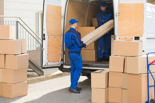 Office removals planning in Friern Barnet with moving boxes and office furniture