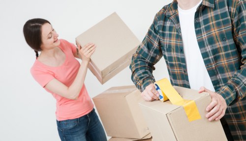 Professional team handling office furniture during a Friern Barnet move