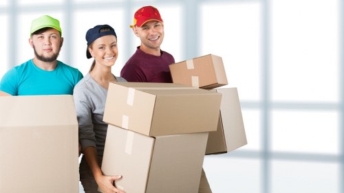 House removal team preparing furniture for transport in Friern Barnet