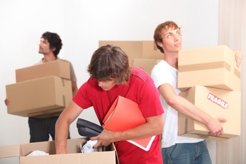 Moving crew loading household items for a Friern Barnet relocation