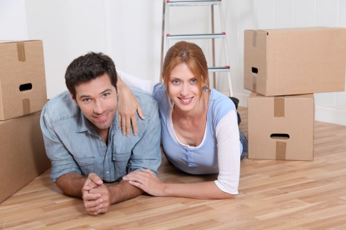 Professional movers loading boxes and furniture for a home move