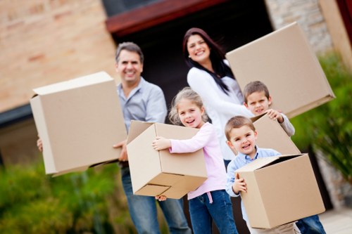 Removals team planning a move on a Friern Barnet residential street