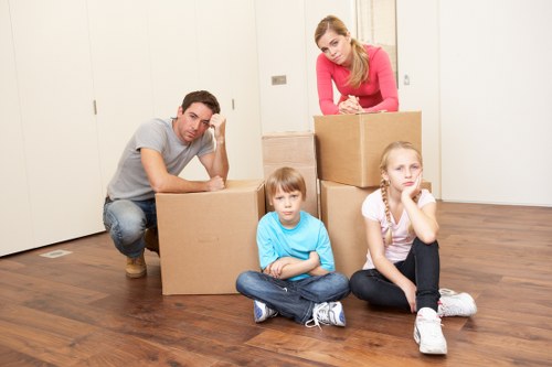 Careful loading of furniture from a flat with stair access