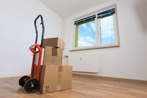 Local movers handling equipment in a Friern Barnet commercial property